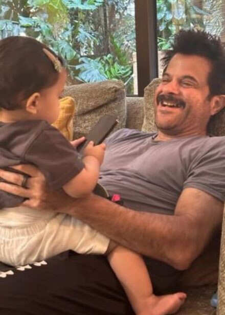 Anil Kapoor holds little Sonam Kapoor in his arms on this throwback photograph